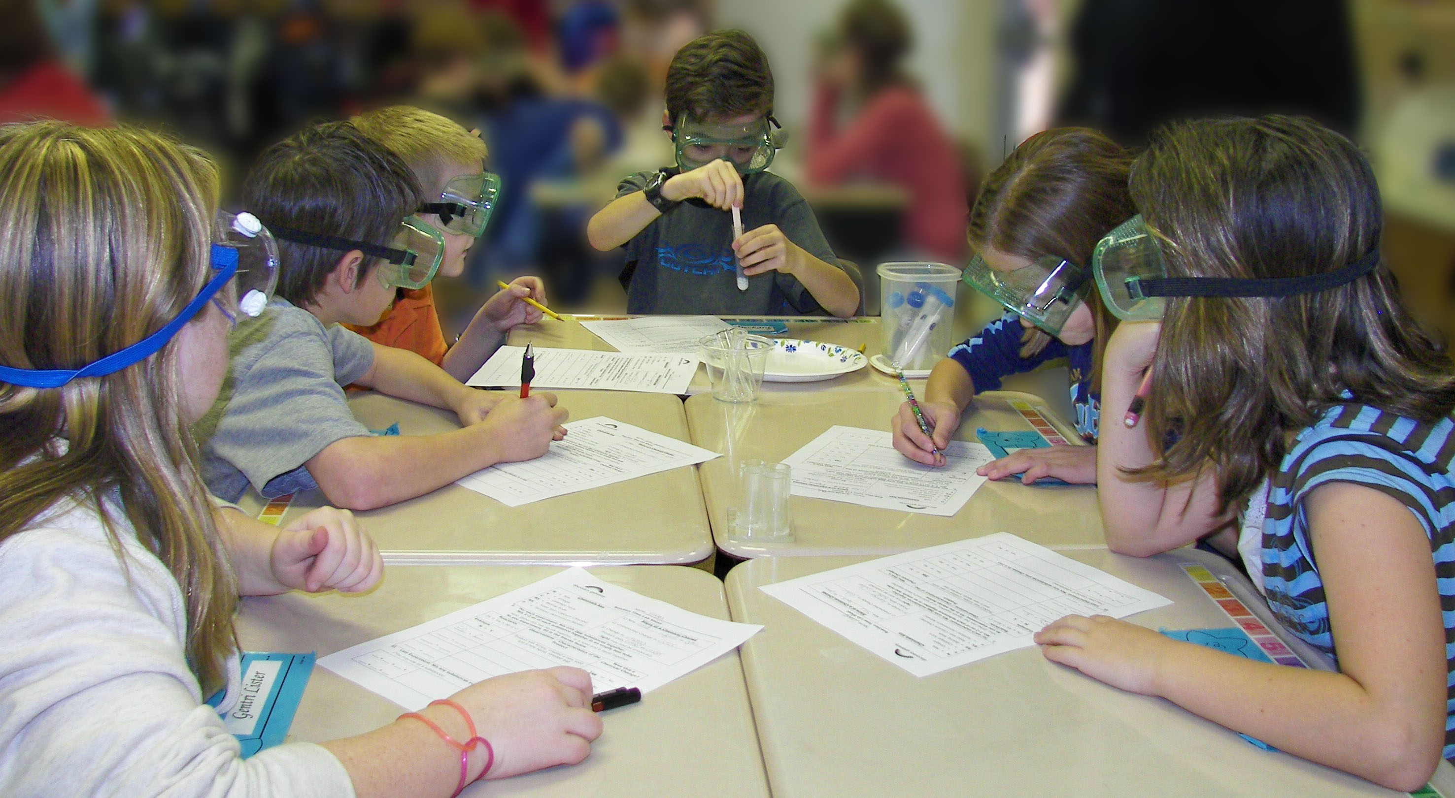 Kids experimenting with test tubes.