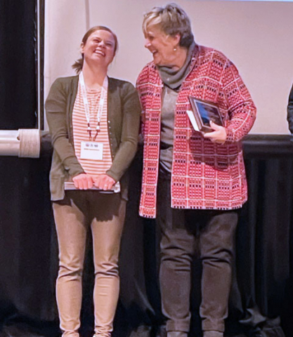 Nikki Lamoreaux with award
